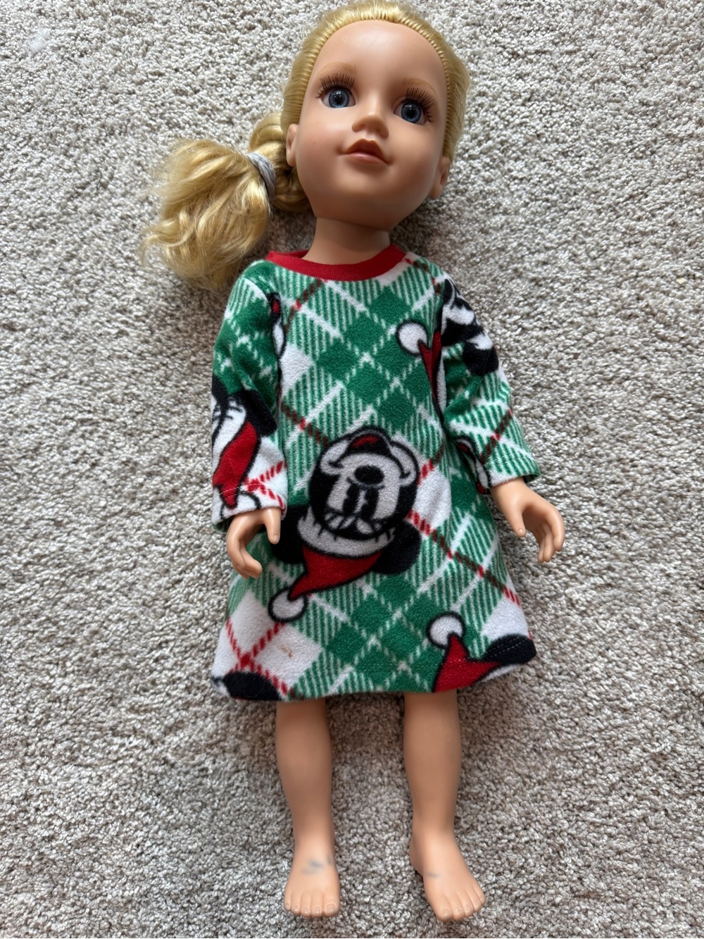 Journey girls Doll wearing Christmas pajamas with Mickey Mouse print.